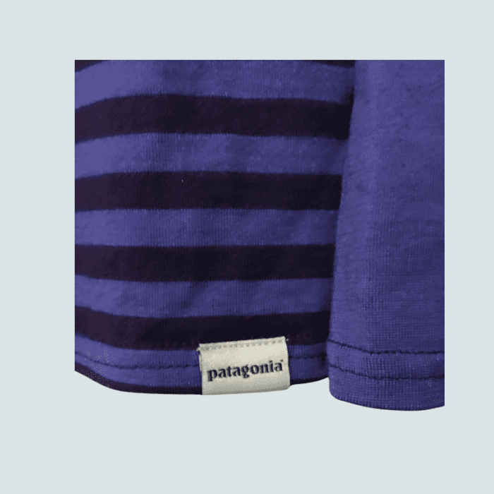 A women's Patagonia purple striped large size base layer